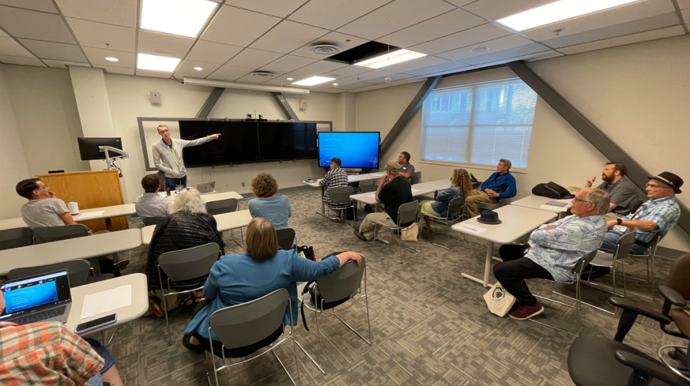Danny Dehaze, Executive Director of Infrastructure, leading a session on instructional technology at the Fall 2023 Faculty In-Service, discussing the Zoom room hubs, new classroom technology, student information systems, and other service items