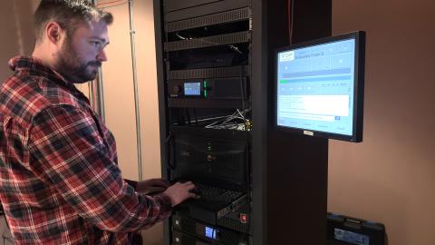 ​  Edit media John Hayes checks the setup for the day's showing in the theater's projection area.  ​