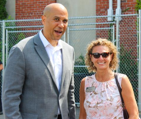 New Jersey State Director Jane Asselta stands alongside U.S. Senator Cory Booker (D-NJ) during an event in Phillipsburg, NJ, in August 2023.  