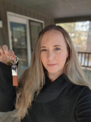 Julie Abati holding up keys to the front door