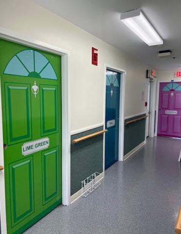 Brightly colored doors in a MRCS memory care unit