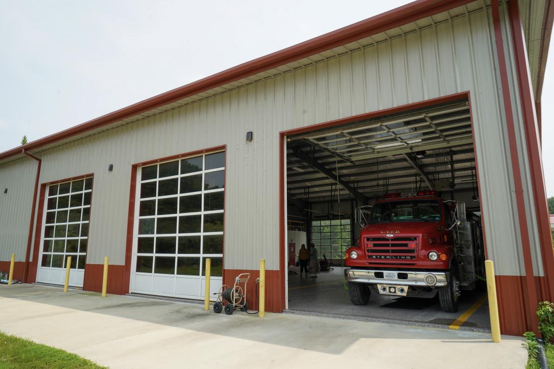 Virginia fire station with an open bay and fire truck inside.