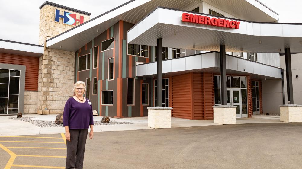 CEO Margie Molitor standing in front of Hot Springs Health.