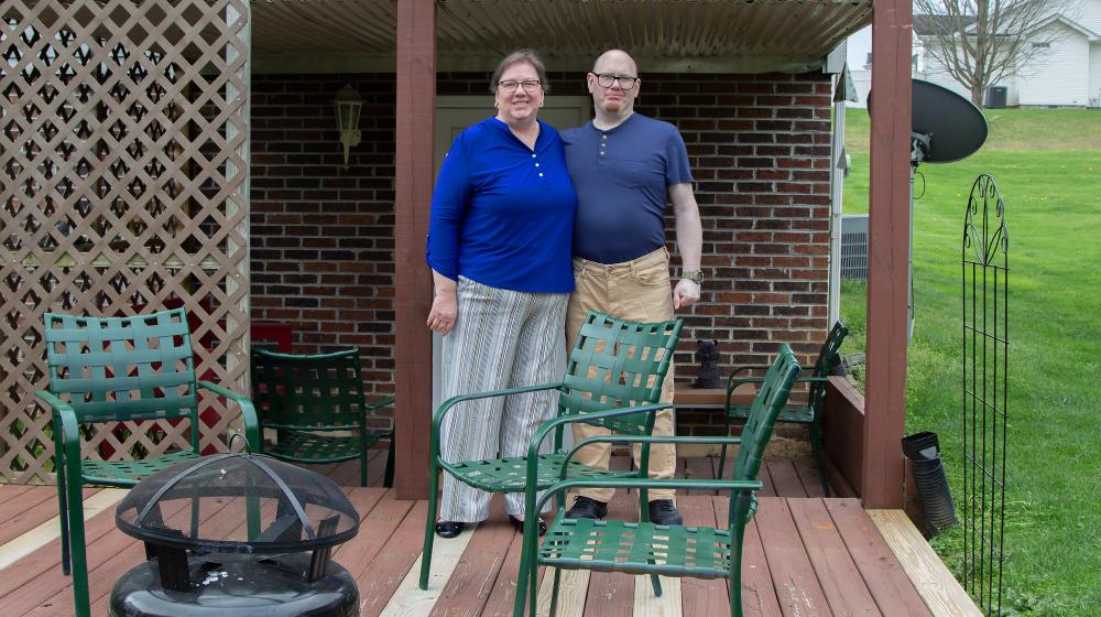 Mary Ann and Eric Forrester on the back deck of their new home purchased with help from USDA Rural Development