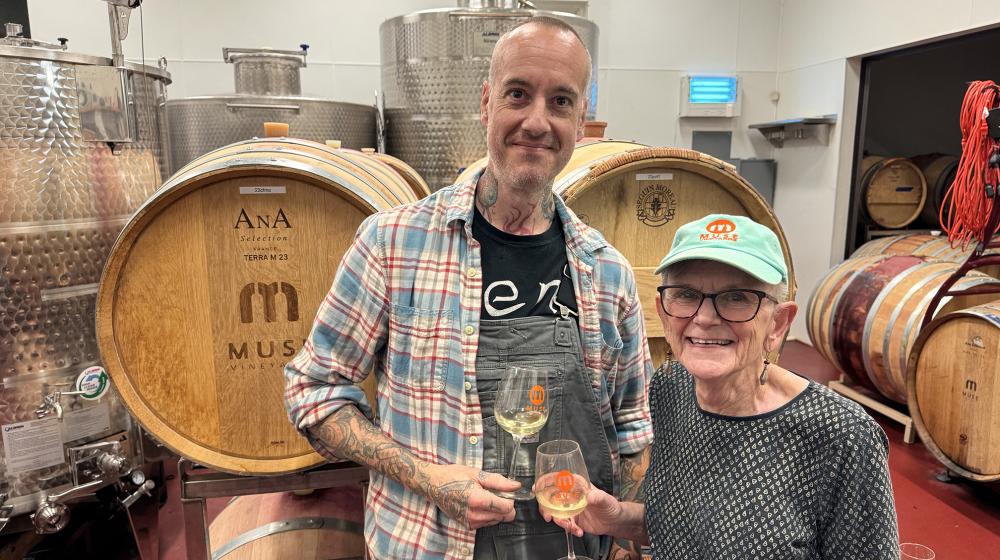 Sally Cowal lifts a glass with assistant winemaker Joshua Riesner