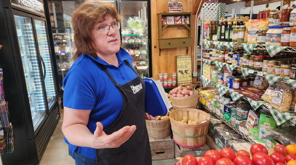 A woman gesturing in a store