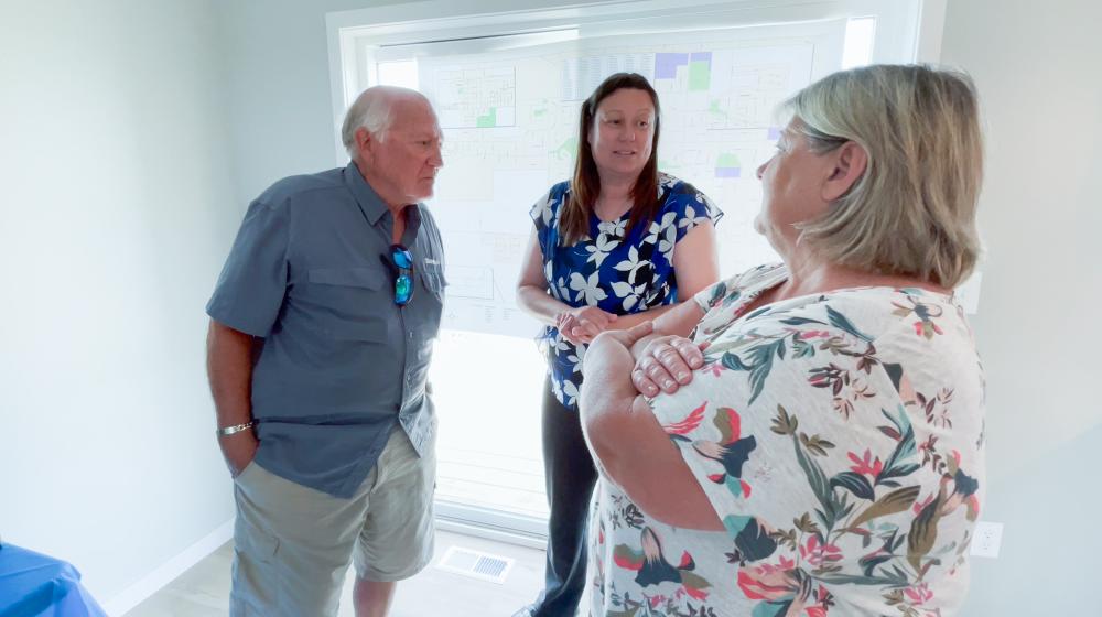 Roxanne visits with guests during homeownership event