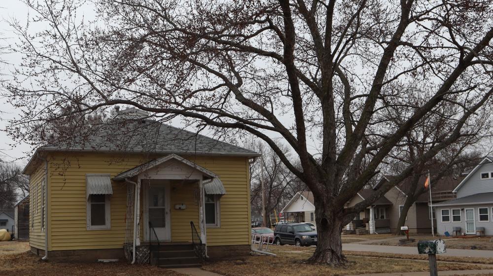 Picture of a yellow house in rural Nebraska