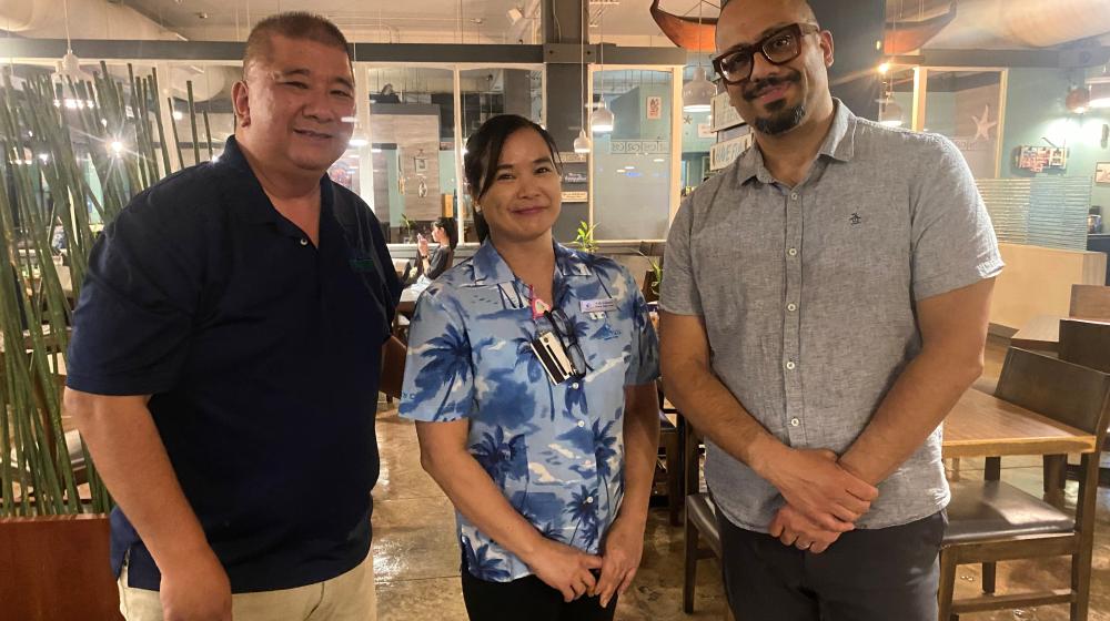 Western Pacific Area Director Joe Diego, Homeowner Cely Valencia and Rural Housing Service Administrator Joaquin Altoro get together for a photo during Altoro's recent Guam visit. 