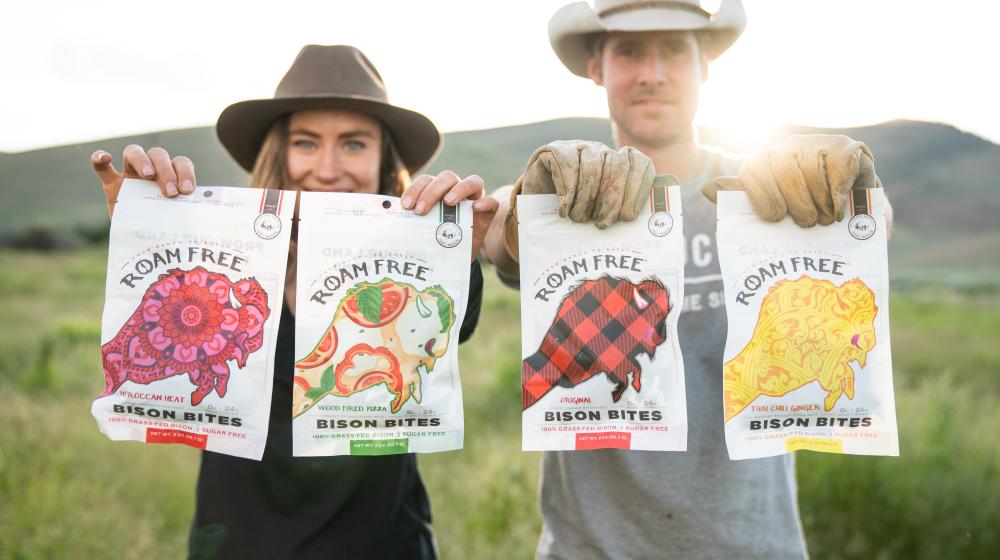 People holding bison jerkey