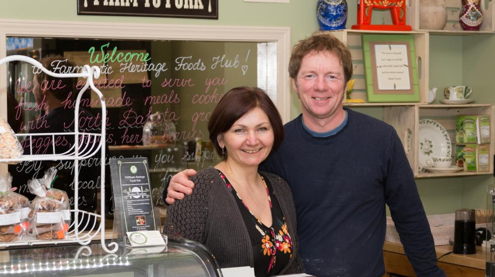 Two owners behind store counter