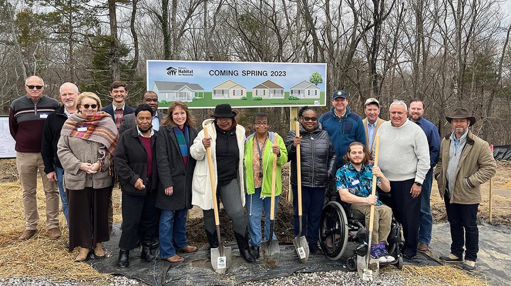 Group photo of new borrowers and Piedmont Habitat for Humanity team