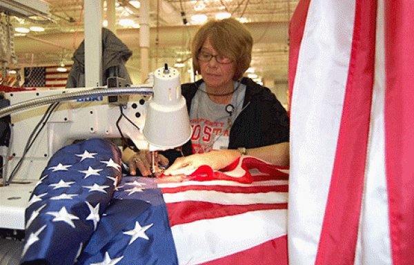 In this photo, courtesy of Annin Flagmakers, employee Carol Wolfe sews an American flag at the company&#039;s Coshocton, Ohio facility. 