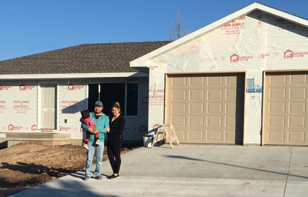 The Echeverria Family outside their new home.