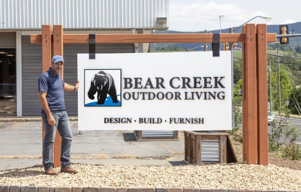 Brian Mininger with the Bear Creek sign