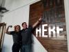 Couple pointing to Nevada shape sign at The Grid Restaurant in Fallon Nevada