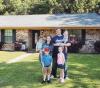 Party of Six proudly displaying their first home.