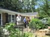 Ms. Dearing on her porch (center) social distance visiting from USDA housing program team members Wes and Qula.